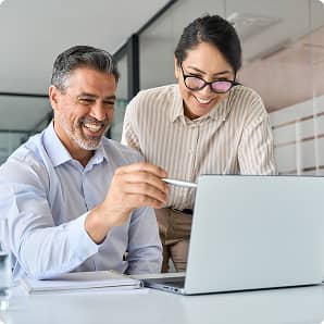 business professionals looking at a laptop