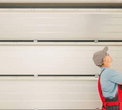 technician working on garage door