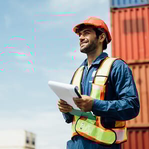 construction manager on site with clipboard