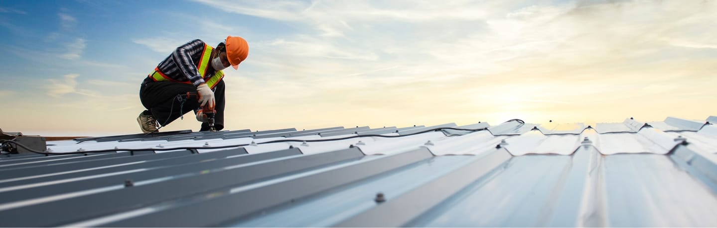 roofer evaluating roof
