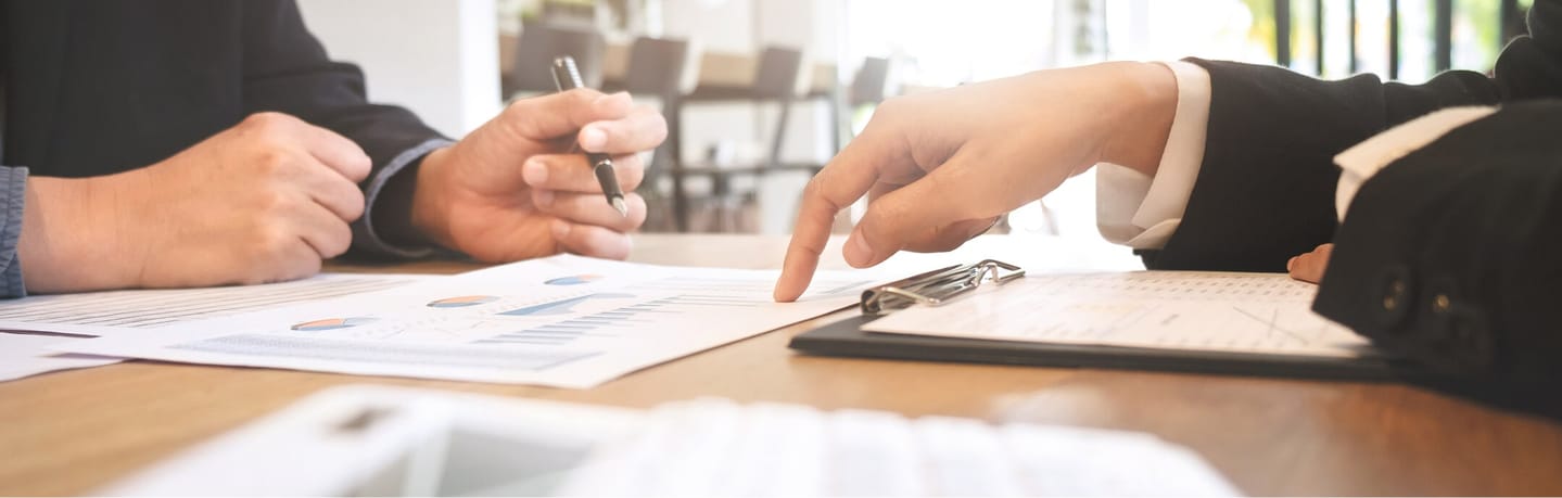 business professionals reviewing reports