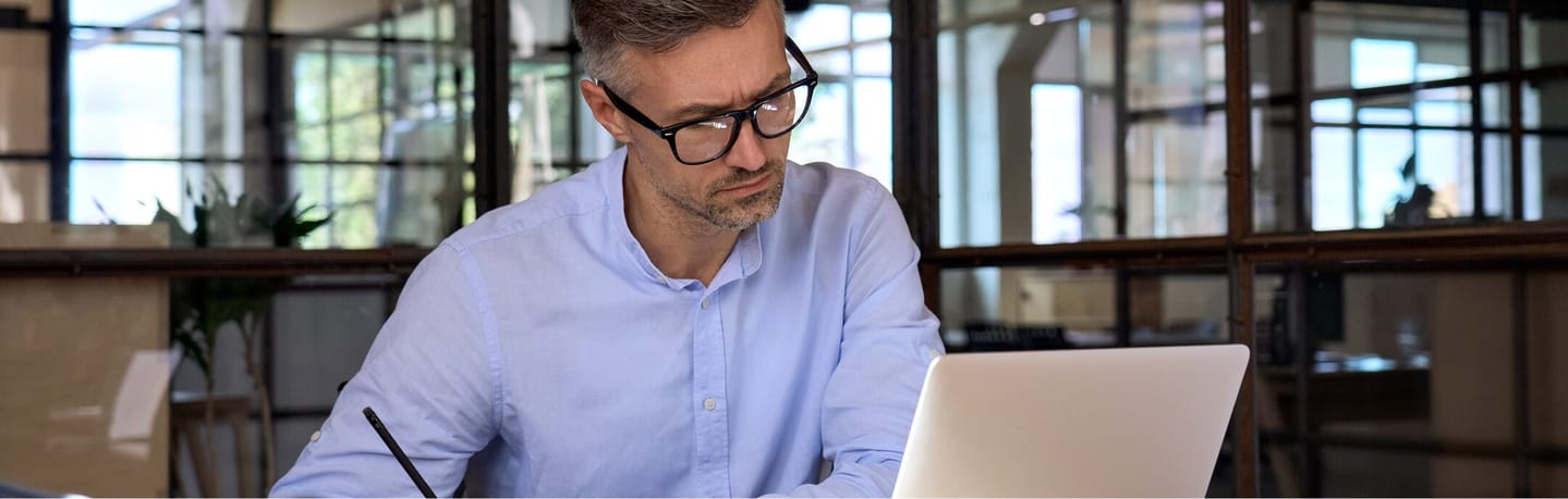 man looking at laptop