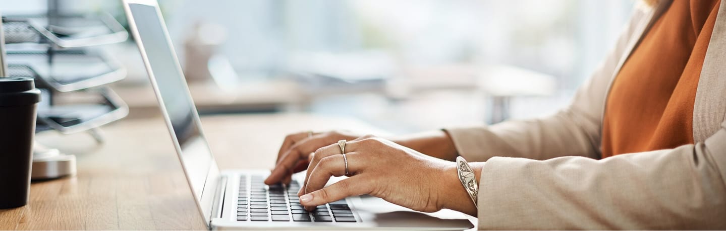 business woman typing on laptop