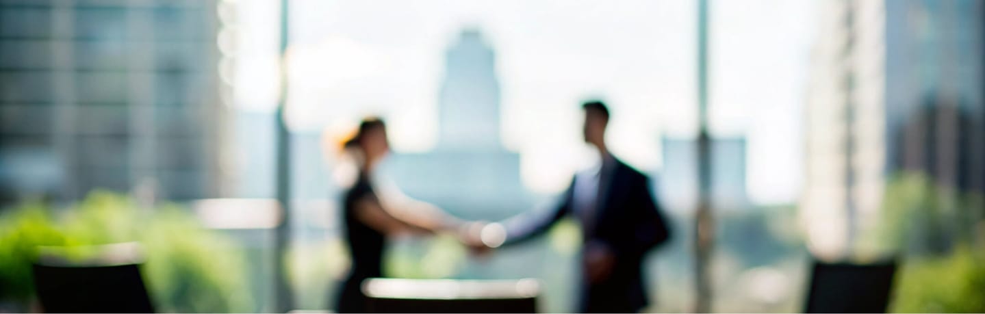 business woman and man shaking hands