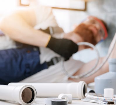 plumber fixing pipes