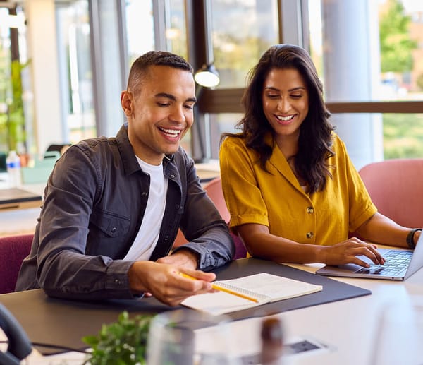 business woman and man reviewing documents