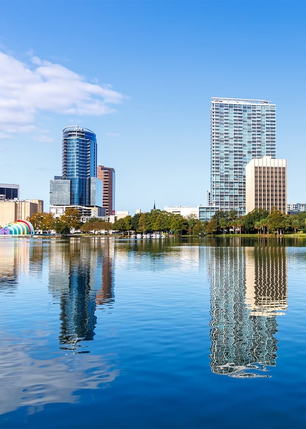 Orlando, FL skyscrapers behind body of water