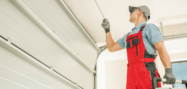 technician working on garage door